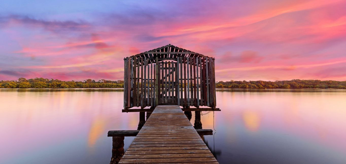 Brown-Wooden-Dock-on-Calm-Body-of-Water Brown Wooden Dock on Calm Body of Water